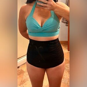 High waist bikini swim suit. Turquoise top and black bottom.